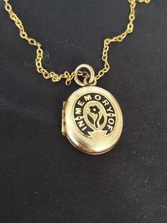 "A beautiful antique 1900's Victorian gold locket pendant with gold chain.  Designed in an oval shape with a wonderfully designed \"In Memory Of\" front. The opening mechanism is in excellent working order as are the two compartments inside. One with a woven lock of hair. A wonderful piece of history to keep a loved one or family member close to you at all times. ▪ Overall Condition: Excellent ▪ Metal: 9ct Gold Locket  ▪ Metal:9ct Gold Chain        ▪ Insurance Estimate: £1395 ▪ Payment Layaway Plan Available: Yes ▪ Full Detailed Appraisal: Quotation Available As a qualified Gemmologist and Jeweller with over 20 years experience in the jewellery  industry, each jewel is chosen for its  'quality, beauty and interest'... As a Consultant in a contemporary jewellery gallery I am privileged to h Antique Gold Locket Necklace With Vintage Charm, Antique Keepsake Locket Necklace With Hallmark, Vintage Engraved Oval Pendant Locket Necklace, Vintage Engraved Oval Locket Necklace, Vintage Locket Necklace With Hallmark For Memorial, Vintage Locket Necklace Hallmark Keepsake, Vintage Locket Necklace As Keepsake With Hallmark, Vintage Locket Necklace Hallmark For Keepsake, Vintage Locket Necklace Keepsake With Hallmark