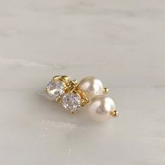 DETAILS:- Available in silver, gold or rose gold - Choose your own pearl color- .75" length- .25" width- Lightweight, easy to wear- Pearl measures 8mm- Nickel and lead free- Securely packaged in a signature gift box- Easy returnsSHOP THE COLLECTION:https://www.etsy.com/shop/TigerlillyCouturePACKAGING:Arrives in a custom Tigerlilly box, perfect for gifting and storing the jewelry.Printed receipts are not included in the box. You may print a receipt directly from Etsy for your records.If it is a g Dainty Pearl White Earrings For Pierced Ears, Classic Single Pearl White Earring, White 14k Gold Filled Bridal Earrings As Gift, 14k Gold Filled White Bridal Earrings As Gift, White Dainty Cubic Zirconia Bridal Earrings, Dainty White Cubic Zirconia Bridal Earrings, Rose Gold Earrings With Pearl Charm For Anniversary, Gold Delicate Hypoallergenic Pearl Earrings, Delicate Gold Pearl Single Earring