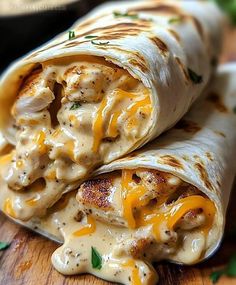 chicken enchilada wrapped in tortilla wrap on a wooden cutting board