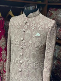 Sienna brown excellent detailing of vintage motifs accentuated with thread and sequence details with mandarin collar in cut dana and zardozi work. Available with matching churidar. Size: 38,44 Ready to Ship! Designer Brocade Bandhgala With Chikankari Embroidery, Straight Kurta Nehru Jacket With Intricate Embroidery For Reception, Reception Nehru Jacket With Intricate Embroidery, Nehru Jacket With Intricate Embroidery For Reception, Designer Brocade Sherwani With Chikankari Embroidery, Transitional Bandhgala With Chikankari Embroidery In Brocade, Fitted Bandhgala With Chikankari Embroidery For Festive Occasions, Festive Fitted Bandhgala With Chikankari Embroidery, Fitted Nehru Jacket With Cutdana For Reception