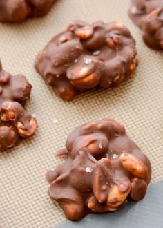 chocolate covered cookies sitting on top of a cookie sheet