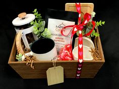 a wooden box filled with coffee and other items