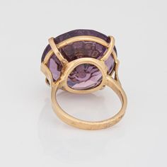 Stylish vintage amethyst & seed pearl ring (circa 1950s to 1960s) crafted in 14 karat yellow gold.   Round faceted amethyst measures 21mm diameter (estimated at 23 carats). The 9 seed pearls each measure 1.5mm. The amethyst is in very good condition and free of cracks or crisps (few light surface abrasions from normal wear).   The rich royal purple amethyst is set with a star pattern of seed pearls, uniquely flush set into the amethyst. The statement ring adds a nice pop of colour on the hand. T Antique 14k Stamped Amethyst Ring, Formal Vintage Amethyst Ring, Collectible Yellow Gold Amethyst Ring, Vintage Yellow Gold Amethyst Ring, Vintage 14k Stamped Amethyst Ring, Vintage Gold Amethyst Rings, 14k Gold Vintage Amethyst Ring For Formal Occasions, Vintage 14k Stamped Amethyst Round Ring, Vintage Purple Amethyst Ring Stamped 14k