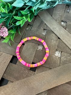 This bracelet is made of clay beads in various shades of pink and yellow. The color scheme is bright and cheerful, perfect for adding a pop of color to any outfit. The bracelet is strung on a durable elastic cord that stretches to fit most wrists comfortably. It would make a great addition to any jewelry collection or a thoughtful gift for someone who loves unique accessories. These jewelry pieces are designed with lightweight beads and are easy to wear.  Take good care of them by storing them i Colored Clay, Clay Bead Bracelet, Schmuck Diy, Unique Accessories, Clay Bead, Pink And Yellow, Small Jewelry, Clay Beads, Accessories Unique