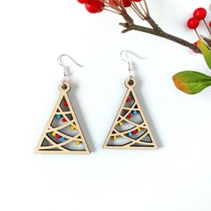 the earrings are made out of wood and beaded with colorful beads on each side