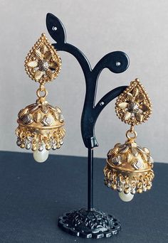 Beautiful rare crafted Jhumka earrings. Earring length 2.5 inches. Earring width: 1 inch. Gold Cutdana Dangle Jhumkas, Gold Dual-tone Earrings For Festive Season, Gold Dual-tone Earrings For Festive Occasions, Gold Dual-tone Danglers, Gold Dual-tone Bridal Earrings For Festivals, Festive Gold Dual-tone Earrings, Festive Dual-tone Gold Earrings, Gold Dual-tone Ceremonial Earrings, Gold Dual-tone Earrings For Ceremonial Occasions