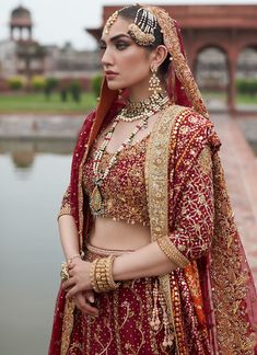 Red Golden Lehenga Choli for Pakistani Bridal Wear is emblazoned in its embroidered work on choli and golden red lehenga paired with net dupatta looking purely traditional in its design and combination of red colored on a chiffon base. Lehenga Kameez: NameerabyFarooq perfectly picked scarlet red to make the bride a sure shot show stopper Heavily embellished in mukesh aari zardozy and threadwork all exclusively embellished by our expert hand artisans. The choli is heavily embellished on the body Red Bridal Gown, Golden Lehenga, Heavy Dupatta, Choli Dress, Lehenga Dupatta, Bridal Dupatta, Shot Show, Red Lehenga, Unique Outfit