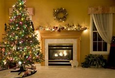 a decorated christmas tree in front of a fireplace