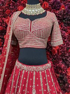 Go all out in this whimsical lehenga, studded with precious mirror, pearl, stone, embroidery work, which is sure to bring out the innate grace and grandeur in you! Color - Crimson Red Fabric & Work Style - - Silk blouse: mirror, pearl, stone, embroidery work. - Soft net lehenga: mirror, pearl, stone, embroidery work. - Soft net dupatta: embroidery work. Details - - Assured quality - Wash care instruction: Dry clean only. - Slight variation in color is possible due to digital photography. Indian Bridal Couture, Dupatta Embroidery, Stone Embroidery, Fabric Work, Indian Bridal Lehenga, Lehenga Wedding, Net Lehenga, Pearl Stone, Indian Groom