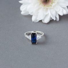 Baguette cut Sapphire and moissanite gold ring | Etsy Rectangular Lab-created Sapphire Ring For Anniversary, Radiant Cut Sapphire Ring With Diamond Cut For Wedding, Anniversary Rectangular Lab-created Sapphire Ring, Moissanite Baguette Cut Diamond Promise Ring, Three Stone Radiant Cut Ring For Gift, Baguette Cut Moissanite Diamond Promise Ring, Radiant Cut Three Stone Ring Gift, Baguette Cut Moissanite Promise Ring, Modern Baguette Cut Sapphire Ring For Anniversary