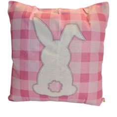 a pink and white pillow with a bunny on it's side, embroidered onto the front