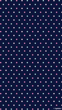 a blue background with small pink and green dots