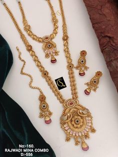 Description :- Long Choker Indian Traditional Wedding Bridal Wear Gold Plated Necklace Earrings Tika Kundan Diamond Fashion Jewelry Set 2 Piece Combo Set The biggest highlight of this manalis necklace set lies in its detailing. The designers at Tarinika have put meticulous attention to details in order to perfect the detailing of the unique and intricate design. The bead-like design of the necklace's chain fuses ethnic style with contemporary flairs. 100% Satisfaction Guarantee: 1 Year Warranty, Gold Jewelry Fashion Necklace Long, Luxury 22k Gold Jewelry Sets With Intricate Design, Luxury 22k Gold Temple Bridal Necklace, Gold Peacock Design Jewelry Sets For Weddings, Temple Jewelry Sets With Peacock Design For Weddings, Indian Traditional Wedding, Necklace Set Indian Bridal Jewelry, Antique Gold Jewelry Indian, Diamond Fashion Jewelry