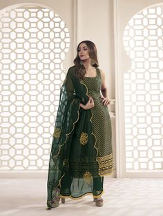 This great winter ensemble from Malaika Arora is perfect for your next special occasion. It includes a bottle green kurta set crafted from silk blend brocade, cotton and organza. Featuring Zari woven designs, a U-neck and calf length trousers, this set is sure to make a statement. It is dry clean only and designed specifically by the Bollywood Diva herself. TOP: Silk Blend(Brocade), TOP INNER: Cotton, BOTTOM: Cotton, DUPATTA: Organza, Dry Clean Green Palazzo Set With Dabka Work And Straight Kurta, Green Unstitched Palazzo Set With Resham Embroidery, Green Art Silk Saree-style Palazzo Set, Bollywood Green Palazzo Set With Chikankari Embroidery, Green Palazzo Set With Sheer Dupatta In Traditional Drape, Designer Green Anarkali Set With Chikankari Embroidery, Embroidered Green Palazzo Set In Traditional Drape, Festive Green Palazzo Set With Dupatta, Green Embroidered Chanderi Palazzo Set