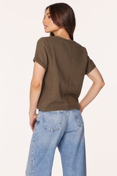 Upgrade from a classic tee with this cotton-gauze v-neck top in a boxy, cropped silhouette. In our signature beach gauze, this army green top travels well, combining both comfort and elevated-casual style. *100% Cotton *Body Length: 20" *Beach Gauze *Model is 5’8 1/2” and wearing size SMALL 53E-72294 Cart Icon, Mail Icon, Elevated Casual, Circle Outline, Bag Icon, Green Top, Instagram Icons, Green Tops, V Neck Tops