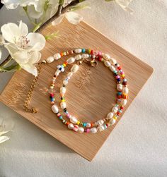 It is a handmade and colorful pearl necklace made of Miyuki and freshwater pearls. 🌸 It can be perfectly combined with simple outfits or makes a colorful statement 💌. Of course, it is also the perfect gift idea for you or your loved ones.  The necklace in pastel: https://www.etsy.com/de/listing/1163669569/handgemachte-bunte-halskette-in The bracelet looks great too! :) https://www.etsy.com/de/listing/1241794829/aruba-handgemachte-perlenarmbander-in If you want a different length, please write to me! :) DESCRIPTION: Tired of boring jewelry? Perfect - this cute & colorful necklace is a perfect eye-catcher for everyone. 💖 Choose your own clasp color and start creating your new favorite necklace! Note: If you choose "silver" as the clasp color, for example, the spacer beads will also be sil Colorful Pearl Necklace, Handmade Pearl Jewelry, Pearl Jewelry Gift, Colorful Necklace, Necklace Colorful, Summer Necklace, Colourful Necklace, Affordable Jewelry, Aruba