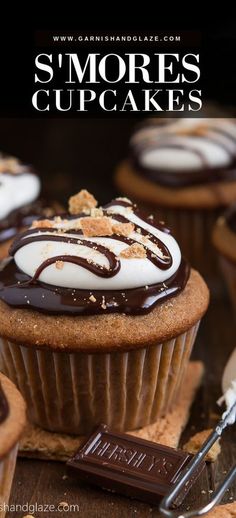 some cupcakes with white frosting and chocolate drizzle on top