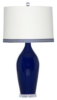 a blue table lamp with a white shade