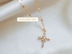 ∙ ∙ S P A R K L I N G ∙ C R O S S ∙ N E C K L A C E ∙ ∙ Made with the following: Gold Plated Cross 23mm x 9mm 14K Gold Filled Findings 14K Gold Filled Spring Clasp 14K Gold Filled Chain This listing is for one necklace. The third picture shows the necklace paired with the Mini Paperclip Necklace https://www.etsy.com/listing/985278174/ and the Sweet to the Soul Necklace https://www.etsy.com/listing/766035933/ (sold separately). ∙ ∙ H O W ∙ T O ∙ O R D E R ∙ ∙ Please select the chain and length fr Dainty Cross Pendant Necklace For Gift, Dainty Pendant Cross Necklace For Gift, Dainty Cross Pendant Necklace As Gift, Dainty Pendant Cross Necklace, Delicate Cross Pendant Necklace For Gift, Delicate Cross Necklace Perfect As A Gift, Delicate Cross Necklace For Gift, Dainty Cross Necklace For Gift, Delicate Cross Necklaces For Weddings