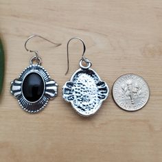 Visit our on-line shop at: Etsy.com/shop/AlbuquerqueDesigns *sterling silver earrings / big concho earrings *dangles / hooks / ear wires / boho earrings *southwestern *black onyx / black stone *calibrated pre-cut stones: big 14x10mm oval shape *back of jewelry items are all covered / do not show the back of stones *all jewelry items are made to ship, slight variations in stones will occur comparing to pictures. *size of a penny is 19mm or a dime is 18mm in diameter for comparing size with jewelr Vintage Black Dangle Jewelry, Silver Teardrop Jewelry With Black Enamel, Vintage Black Jewelry With Matching Earrings, Sterling Silver Black Enamel Drop Earrings, Sterling Silver Drop Earrings With Black Enamel, Black Enamel Sterling Silver Drop Earrings, Black Sterling Silver Jewelry With Matching Earrings, Black Teardrop Jewelry With Matching Earrings, Black Dangle Plug Earrings