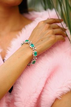 This is a stunning natural Zambian Emerald bracelet which has Emerald of very high quality and diamonds of very good quality . it has vsi clarity and G colour. Emerald : 19.35 cts diamonds : 12.67 cts gold : 19.406 gms Its very hard to capture the true color and luster of the stone, I have tried to add pictures which are taken professionally and by me from my I phone to reflect the true image of the item. It's a brand new piece so all measurements and Weight of the stone are accurate. Please rea Luxury Green Diamond Bracelet Gift, Formal Emerald Diamond Bracelet With Brilliant Cut, Elegant Diamond Gemstone Bracelet For Party, Elegant Emerald Diamond Bracelet For Formal Occasions, Luxury Crystal Gemstone Bracelet, Green Diamond Bracelet For Formal Occasions, Green Diamond Bracelet With Brilliant Cut, Green Diamond Bracelets With Brilliant Cut, Emerald Tennis Bracelet With 17 Jewels For Wedding