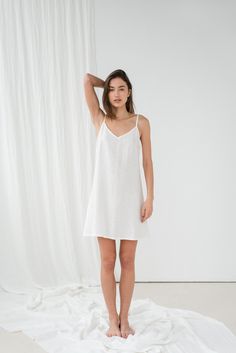 "Basic TILDA cami dress in milky white. - length is ± 92 cm (36.2\") (depends on size) - without pockets - relaxed fit DETAILS: - 100 % European, pre-washed medium weight linen (205 g/m²) - the model is 180 cm (5′11″) high, wearing size S. - model measurements: bust 84 cm (33\") / waist 61 cm (24\") / hips 92 cm (36\") - color in the picture - milky white (you can choose other color on the right) MADE TO ORDER: All pieces are made to order, it will take up to 10 work days to complete your order. White A-line Mini Dress With Adjustable Straps, White V-neck Slip Dress With Delicate Straps, White V-neck Dresses With Delicate Straps, White V-neck Dress With Delicate Straps, White Dresses With Delicate Straps And V-neck, White Sundress With Adjustable Straps For Daywear, White V-neck Slip Dress With Adjustable Straps, White Slip Dress With Delicate Straps For Sleep, White Sundress With Spaghetti Delicate Straps