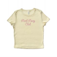 Baby tee with "Pink Pony Club" written in a cowboy rope font and embroidered in pink polyester thread.  The perfect gift for a fan! <3 Drop down menu will reflect the color options shown. Please refer to the size chart on the last slide for accurate measurements. Baby tee fabrication: 52% airlume combed and ring-spun cotton, 48% polyester 32 single, 5.4oz Want a different embroidery color? Message us! We have a large variety of colored thread to choose from. Cute Pink T-shirt With Letter Embroidery, Pink T-shirt With Embroidered Text For Summer, Pink Embroidered T-shirt For Summer, Pink Short Sleeve T-shirt With Embroidered Graphics, Pink Summer Top With Embroidered Text, Pink Tops With Embroidered Text For Summer, Pink Top With Embroidered Text For Summer, Unisex Pink T-shirt For Spring, Pink T-shirt For Spring