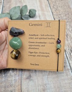 Welcome to Purus Sensa 💚  All of our crystals are hand picked for their quality & beauty.  Please message me any queries, as I'm always happy to help. The gift is designed so that the crystals can be removed safely from the card.  The set includes: 1x raw amethyst 1x green Aventurine tumble 1x tiger eye sphere 1x handmade gemstone bracelet / anklet  They will arrive in an organza gift bag, gift wrapped and packaged in 100% biodegradable packaging 🌏 There's an option at checkout to add a gift n Gemini Bracelet, Zodiac Crystals, Biodegradable Packaging, Raw Amethyst, Gemini Zodiac, Handmade Jewelry Gift, Crystal Set, Star Sign, Organza Gift Bags