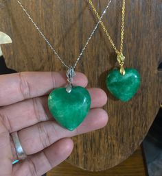 Beautiful polished natural jade stone heart necklaces. In gold colored or stirling silver. Jade is well known stone for good fortune and luck, prosperity. Great hues of greens all throughout the stones. Green Jade Heart Necklace, Heart-shaped Emerald Necklace For Gift, Heart Cut Emerald Necklace For Gift, Emerald Heart Gemstone Necklace, Heart-shaped Green Emerald Necklace As Gift, Green Heart-shaped Emerald Necklace For Gift, Heart-shaped Green Emerald Necklace For Gift, Emerald Heart Shaped Gemstone Necklace, Jade Pendant Necklace For Anniversary