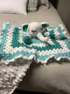 a crocheted blanket with an elephant on it