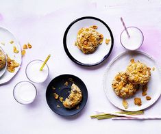 two plates with pastries on them next to drinks