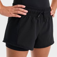 Why we're ALL IN: 2-in-1 shorts made with soft and stretchy fabric to help keep them comfortable through a range of activities, from running to sports practice and casual hangs. A full waistband elastic with drawcord closure makes for a stay-put fit, while a loose fit silhouette offers greater range of motion. All in Motion™: Made for every move, priced for every day.