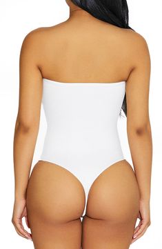 With comfy compression and a crepe-like finish, this curve-hugging bodysuit in a strapless silhouette is a versatile addition to your going-out wardrobe. Strapless 95% viscose, 5% spandex Hand wash, line dry Imported Strapless Shaping Bodysuit With Built-in Bra, Strapless Stretch Shapewear Bodysuit, Strapless Shaping Bodysuit Shapewear, Strapless Shaping Bodysuit, Shapewear Bandeau Bodysuit With Built-in Bra, Strapless Stretch Smoothing Bodysuit, Stretch Smoothing Strapless Bodysuit, Strapless Smoothing Stretch Bodysuit, Solid Strapless Smoothing Bodysuit