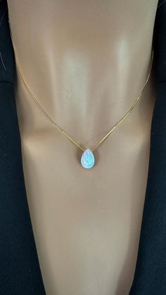 Elevate your style with our breathtaking Teardrop Opal Necklace, a stunning piece that beautifully showcases the iridescent charm of the October birthstone. Perfect for layering or as a minimalist statement, this delicate opal teardrop pendant captures light with every movement, inviting you to embrace its enchanting glow--add it to your collection today and celebrate the magic of opal! Pendant: Lab Opal 8x12mm Chain: 925 Sterling Silver Box Chain, Gold Plated or Rose Gold Plated chain over ster