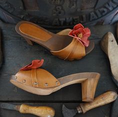 Woman Clogs with high heel in natural wood and Real Leather , handmade by Mario Doni. Woman Clogs Model: Chiara Clogs color: Leather * Heel: 70 mm Upper: Genuine leather Vegetable Color: Leather+ flower Red * On request also available in other colors Sabot made of wood in the best tradition of craftsmanship Tuscany. Uppers made of genuine leather Vegetable-available in a wide selection of colors to give joy to your Summer All our products are made exclusively to order, please contact me for furt Wooden Closed Toe Clogs With Stacked Heel, Wooden Clogs With Stacked Heel And Closed Toe, Closed Toe Mules With Wooden Heel, Wooden Clogs With Open Heel, Brown Open Toe Clogs With Sculpted Heel, Wooden Slip-on Clogs With Wooden Heel, Wooden Clogs With Round Toe, Wooden Closed Toe Clogs With Wooden Heel, Wooden Clogs With Round Toe And Wooden Heel