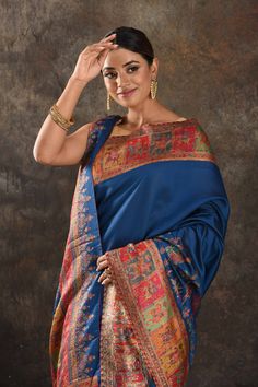 Exquisite blue Kani silk saree is one of a kind drape for a saree wardrobe! It comes with a matching blouse piece. Shop designer sarees in USA from Pure Elegance. Disclaimer: The shown stitched blouse on the model is for display purpose only. The saree comes with a matching blouse piece and finished with fall and piko. The actual product may vary slightly from the image. These are custom orders, hence expect slight variation in color, placement of the motif or buta. ESTIMATED DELIVERYBecause this is a custom order, it would take about 4 weeks from the date of purchase. RETURN POLICYThis product is a custom order and cannot be returned or exchanged. Blue Raw Silk Pre-draped Saree For Festivals, Blue Silk Anarkali Pre-draped Saree, Designer Blue Dupatta For Navratri, Festive Blue Tussar Silk Pre-draped Saree, Eid Tussar Silk Pre-draped Saree In Traditional Drape, Eid Tussar Silk Traditional Drape Pre-draped Saree, Eid Tussar Silk Pre-draped Saree, Eid Traditional Drape Pre-draped Tussar Silk Saree, Bollywood Style Blue Pre-draped Saree For Eid