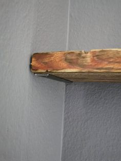 a piece of wood is hanging on the wall