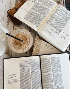 an open book sitting on top of a wooden table