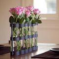 some pink roses in a vase on a table