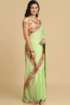 Product Features: Saree: Saree as seen in picture - Choose the drape style while order: Standard, Pleated or Gujarati Saree Fabric: Chiffon Saree Color: Lime Saree Work: Woven Saree Border And Pallu: Lace Border And Fancy Pallu Blouse: Blouse Design Must Be Chosen While Ordering. For The Blouse In Pic, Please Choose The Selection "As Seen In Picture" Or Customize Your Selection Blouse Fabric: Dupion Silk Blouse Color: Cream Blouse Work: Woven Wash: Dry Clean Occasion: Party Disclaimer: There Wil Bollywood Style Pre-draped Georgette Saree For Diwali, Pista Green Chanderi Blouse Piece For Reception, Pista Green Chanderi Pre-draped Saree, Transitional Green Saree With Resham Embroidery, Transitional Season Green Saree With Resham Embroidery, Transitional Art Silk Saree With Mirror Work, Pista Green Pre-draped Saree With Mirror Work For Navratri, Pista Green Anarkali Style Pre-draped Chanderi Saree, Green Georgette Choli With Cutdana