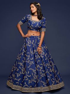 This Royal Blue Silk Lehenga Choli Set is the perfect addition to your closet.This set is crafted on soft and flowy art silk material. The choli comes with 3/4th sleeves with a stunning border on the sleeves and neckline. The lehenga is adorned with embellished detailing, sequins work, dori and tassels. The lehenga comes with can-can. This set comes with a stunning net dupatta that is both light-weight and elegant. Fabric- Art Silk 3/4th sleeves Round Neck Lehenga length: 42 inches Embroidery- Z Blue Silk Sets For Diwali, Blue Silk Set For Diwali, Blue Anarkali Silk Sets, Blue Silk Set For Navratri, Wedding Indigo Sets With Dupatta, Indigo Wedding Sets With Dupatta, Indigo Wedding Set With Dupatta, Bollywood Indigo Sets With Zari Work, Bollywood Style Indigo Sets With Zari Work