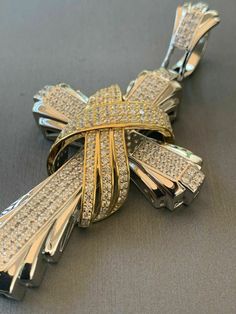 "Men's Custom Made Super Iced Out HEAVY Cross Pendant! Solid 925 sterling silver We have 3 styles! Rhodium finished, two-toned, & 14k yellow gold finished! Color lasts many years!! Measures roughly 2.5\" by 1.5\" ..weighs roughly 25 grams 200 micropaved handset simulated diamonds (CZ) for a total of 3ct! 100% 925 silver...not plated or filled...will NEVER TARNISH OR CHANGE COLOR LISTING IS FOR PENDANT ONLY, CHAIN NOT INCLUDED Bale fits most chains up to 8mm thick!" Luxury Diamond Cut Cross Jewelry, Luxury Cross-shaped Diamond Cut Jewelry, White Gold Diamond Jewelry With Shiny Finish, Silver Cross Jewelry With 17 Jewels, Luxury Cross Pendant Jewelry With Polished Finish, Luxury Silver Cross Jewelry, Luxury Cross Jewelry For Anniversary, White Gold Polished Cross Jewelry, White Gold Cross Jewelry With Polished Finish