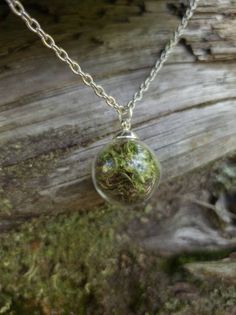 This teeny tiny round glass pendant is filled with real moss! Take a piece of the forest everywhere with you. The ball is about half an inch across. The moss is preserved so it will stay green and lush.  It comes on a nickel- free silver chain with a lobster clasp. Goblincore Necklace, Therian Clothes, Trinket Trading, Forest Accessories, Green Witch Outfit, Goblincore Jewelry, Moss Jewelry, Moss Necklace, Forest Jewelry