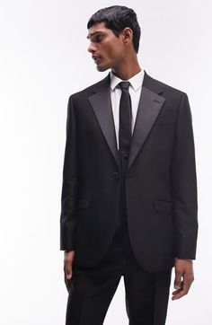 A skinny fit enhances the contemporary appeal of this tuxedo jacket classically detailed with contrast lapels. 30 1/2" length (size 42r) One-button closure Notched lapels Nonfunctional four-button cuffs Chest welt pocket; front flap pockets Partially lined 77% polyester, 17% viscose, 6% elastane Machine wash, line dry Imported Tuxedo Blazer With Hidden Button Closure For Black Tie, Black Tie Tuxedo Blazer With Hidden Button Closure, Fitted Single Breasted Blazer For Black-tie Events, Fitted Single-breasted Blazer For Black-tie Events, Black Tuxedo Sport Coat With Hidden Buttons, Black Tuxedo With Hidden Button Closure For Black Tie, Black Tie Tuxedo Blazer With Notch Lapel, Black Tuxedo With Hidden Button Closure For Formal Events, Sleek Notch Lapel Tuxedo For Black-tie Events