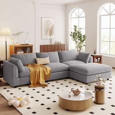 a living room with a sectional couch and coffee table