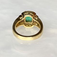 A delightful candy colored vintage natural Colombian emerald ring featuring a bright and lustrous emerald cut center stone weighing 1.50 carats surrounded by a medley of round and baguette white diamonds weighing 0.64 carats. Complimentary resizing is available up to 3 sizes larger or smaller than the stated size. WEB ID: 3B98 Diamond Ring Emerald Cut, Diamond Ring Emerald, Vintage Emerald Engagement Ring, Colombian Emerald Ring, Engagement Ring Emerald, Emerald Ring Vintage, Ring Emerald Cut, Emerald Rings, Emerald Diamond Ring