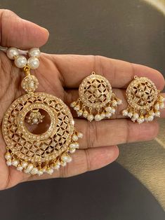 Featuring a traditionally designed pearl pendant set in 925 sterling silver & 22k gold plating. It has been set with freshwater pearls. These evergreen designs never go out of style. Its made by Our expert Amritsari Artisans Made In India / Amritsar-Punjabi Style Jadau Sets Option 1 ) Pearl Design SILVER Weight : 40.650 GMs Pendant Dimensions: 3 x 2 inches Earrings Dimensions: 2 x 1 inches Price: Amritsari Jadau Jewellery, Gold Meenakari Round Pendant Jewelry, Kundan Pearl Drop Necklace For Diwali Gift, Yellow Gold Chandbalis For Gift, 22k Gold Pearl Necklace For Celebrations And Festivals, Kundan Pearl Pendant Necklace As A Gift, 22k Gold Kundan Necklace For Diwali, Pearl Pendant Necklace As Diwali Gift, Pearl Pendant Necklace For Diwali Gift