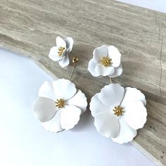 New~ Anthropologie Captiva Floral Front White Flower Jacket Earrings Blooming Flower Blossoms Steal The Show With This Front/Back Jacket Style Earring. Offering A Fresh Floral Look From Both Sides, This Pair Of Earrings Can Also Be Split And Worn As Just Small Flower Studs Or Add The Back Jacket To Another Pair Of Stud Earrings You Already Own.Two Pairs In One! Approx. 2-3/4l", 1-5/8"W Overall. Sm. Flower: 1"L, 1"W. Lg. Flower: 1-5/8"L, 1-5/8"W. Painted White Metal; Gold Plated Center. Nwot. Ant Chic White Flower-shaped Earrings, Trendy 3d Flower Earrings For Spring, White Flower Earrings With Summer Decoration, White Flower Earrings With Flower Decoration For Summer, Chic White Flower Earrings For Wedding, White Summer Flower Earrings, Spring Party White Flower Earrings, Chic White Flower Wedding Earrings, White Handmade Flower Earrings For Spring