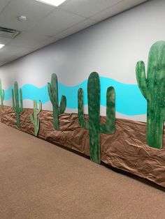 a wall with some fake cactus on it