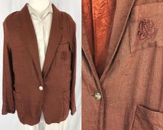 This lovely brown blazer is one of a kind and in great condition! It is a medium chocolate brown blazer with a linen textured look to it. There is an embroidered detail on the front breast pocket, and the same design is on the gold button on the front. The blazer is partially lined inside on the body (not the sleeves) and is a light to medium weight. There are also removable shoulderpads inside. Would look great with academia, cottagecore, historic, or preppy styles. Size: Tag 'Medium', fits like Medium (mannequin in pictures is a Medium). May fit large (if left unbuttoned) due to relaxed fit. Bust: 41 inches Waist: 39 inches Length: 29 inches Cottagecore Jacket, Light Cottagecore, Brown Academia, Medium Chocolate Brown, Vintage Academia, Brown Texture, Brown Blazer, Womens Blazers, Librarian